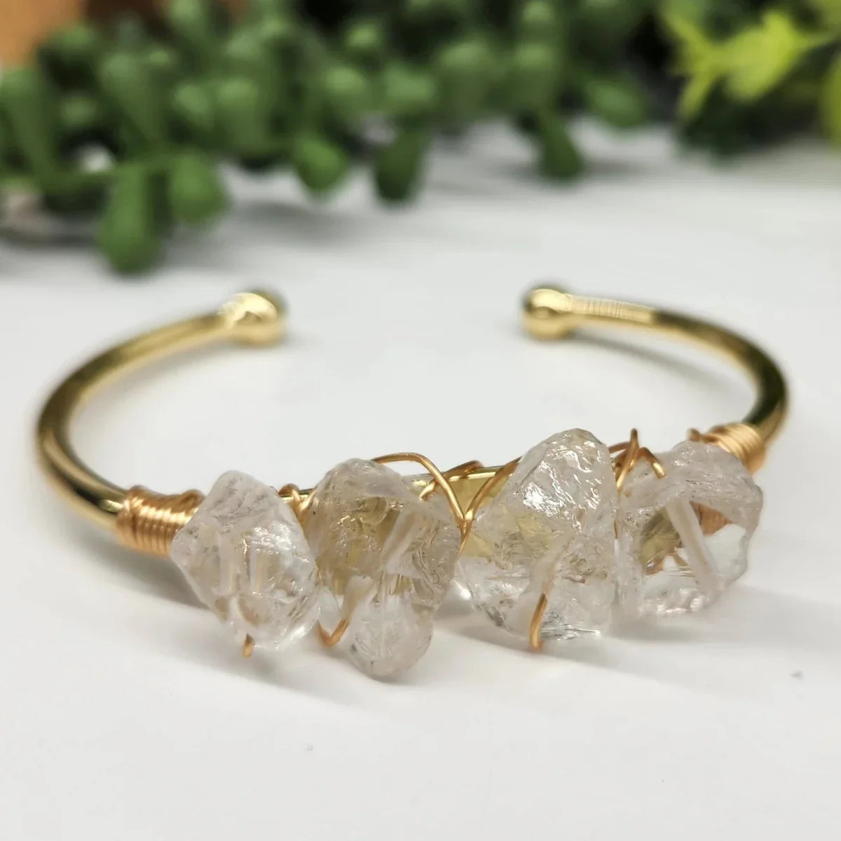 Gold cuff bracelet with raw quartz crystals from Qu!rk Boutique, eco-friendly jewelry