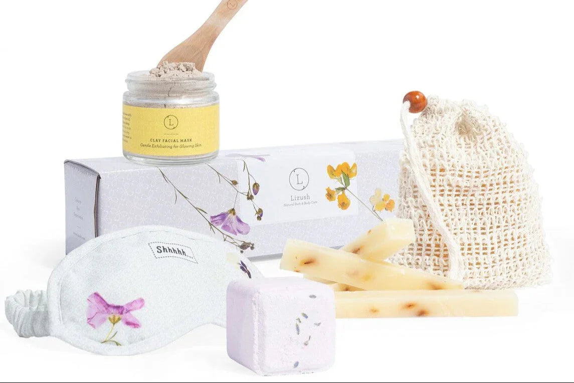 Natural spa set with clay facial mask, sleep mask, bath bars, bath bomb, and woven pouch
