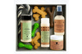 Pet gift set with natural coat protector, deodorizing spray, snout balm, paw balm, treats, and rope toy