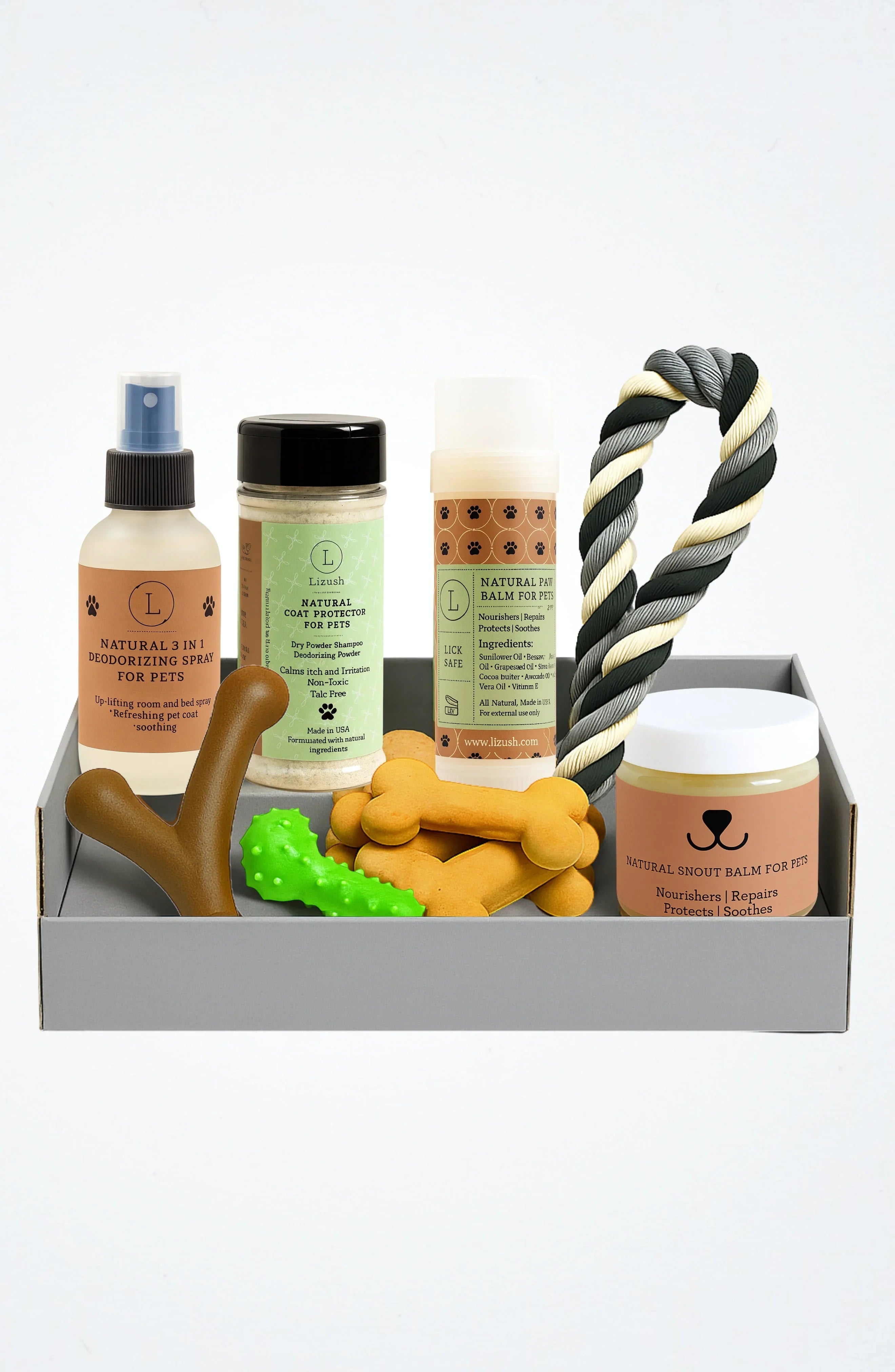Pet care box with natural deodorizing spray, coat protector, balm, snout balm, treats, and rope toy