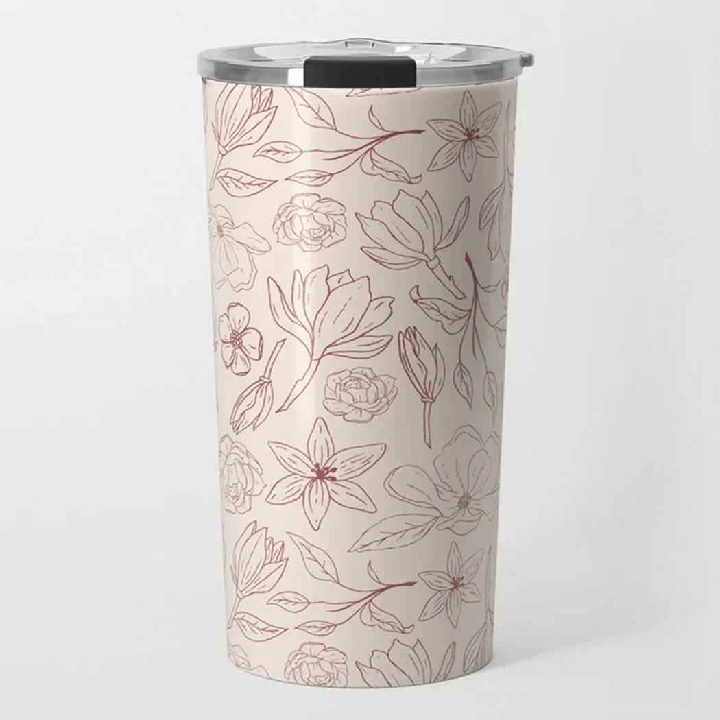 Tall stainless steel travel tumbler with pink floral line art design and silver lid