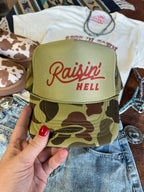 Raisin' Hell Green Camo Trucker Hat - Qu!rk Boutique