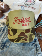 Raisin' Hell Green Camo Trucker Hat - Qu!rk Boutique