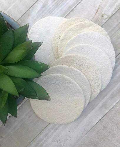 Reusable cotton rounds on light wood with a succulent, sustainable eco-friendly gift