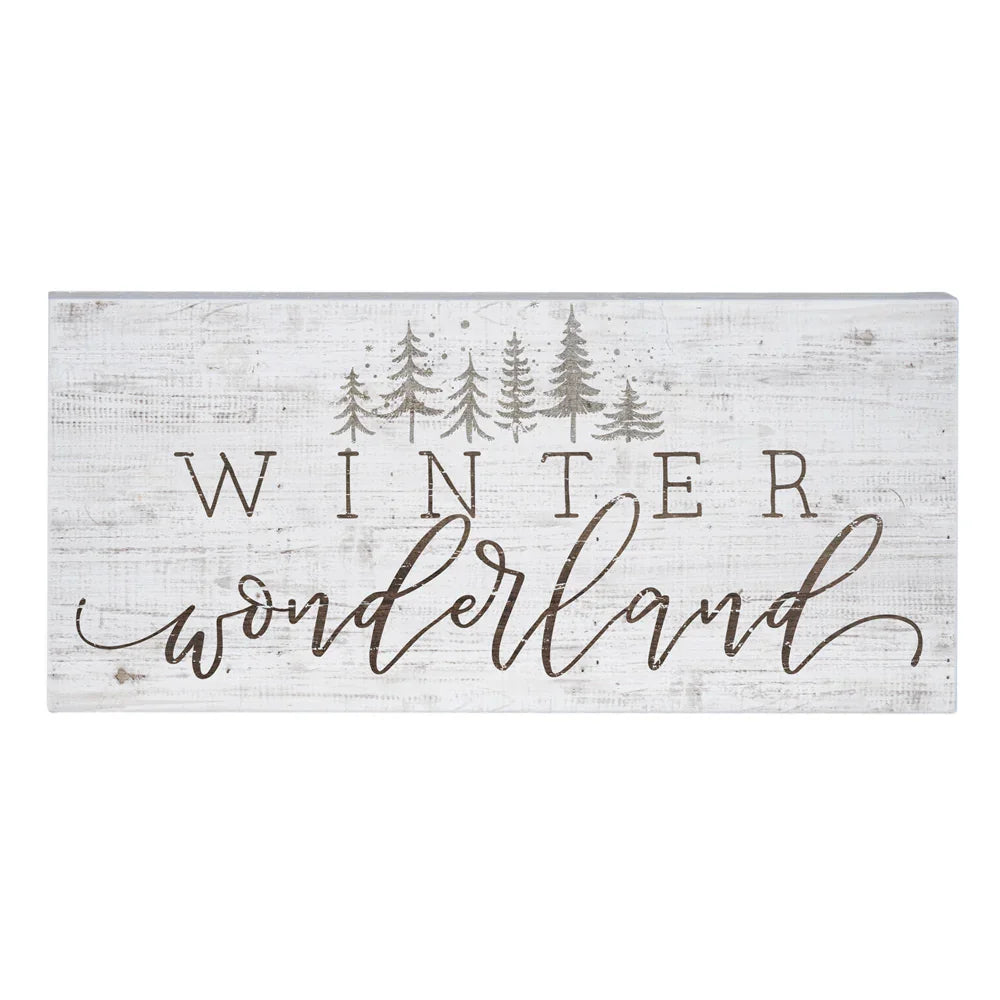 Rustic wooden sign with Winter Wonderland text and pine tree silhouettes