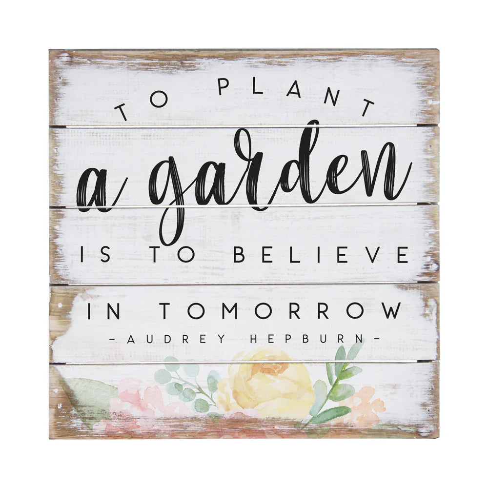 Rustic white wooden sign with floral art and Audrey Hepburn quote, garden-themed decor