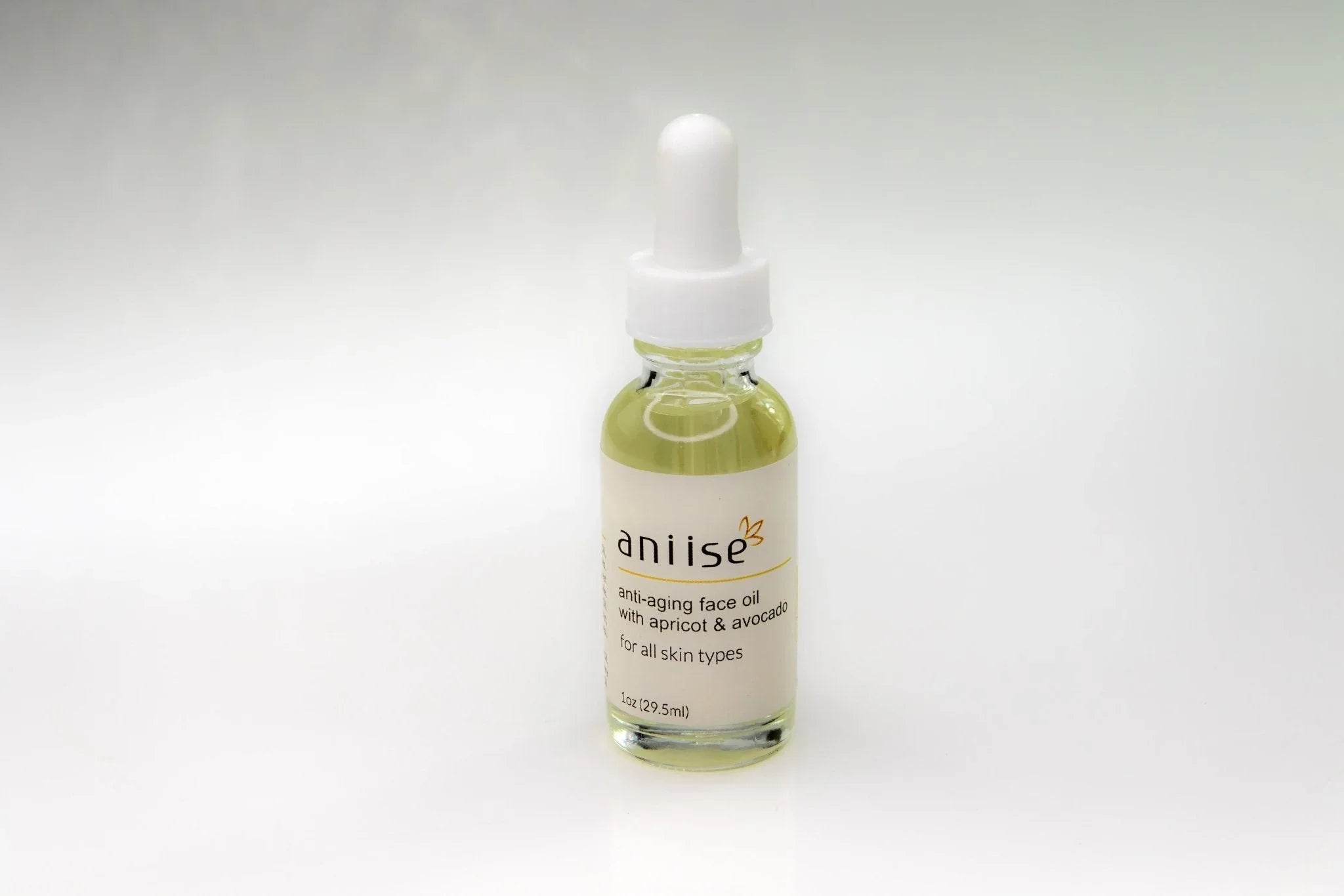 Aniise anti-aging face oil with apricot and avocado for all skin types on white background