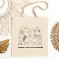 Sustainable tote bag with farm produce illustrations and 'Support Your Local Farmers' text, Qu!rk Boutique.