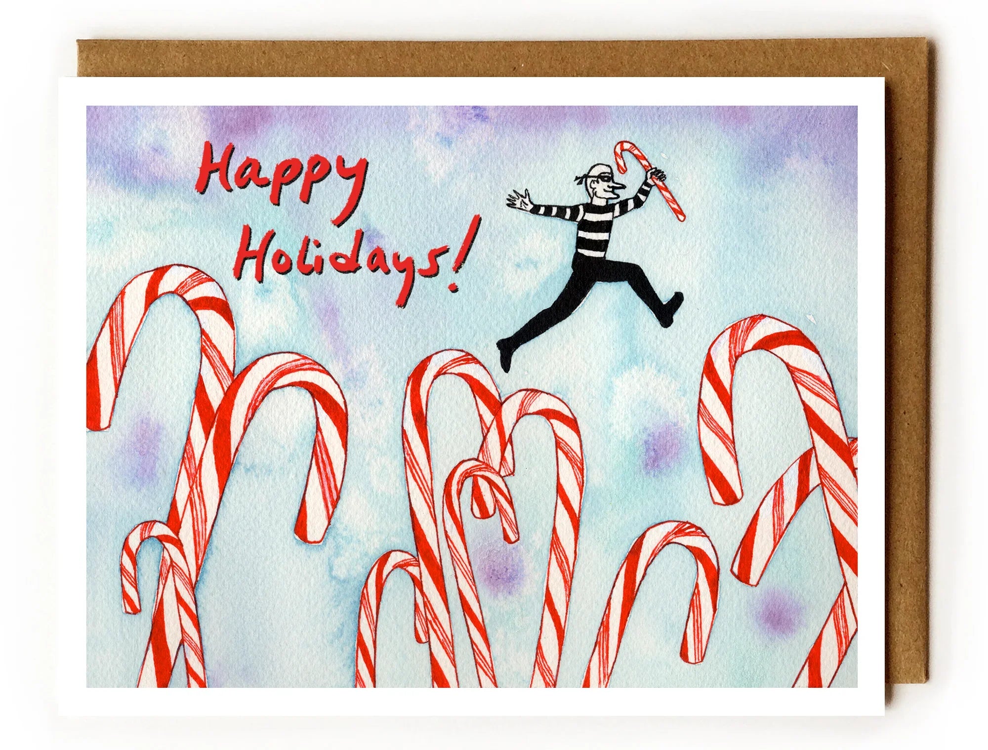 Holiday card illustration with a striped thief leaping over giant candy canes holding a candy cane, Happy Holidays text