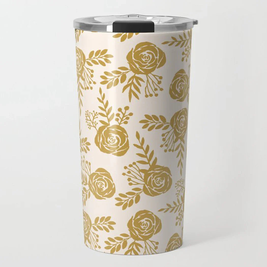 White travel tumbler with gold floral rose pattern and stainless steel lid