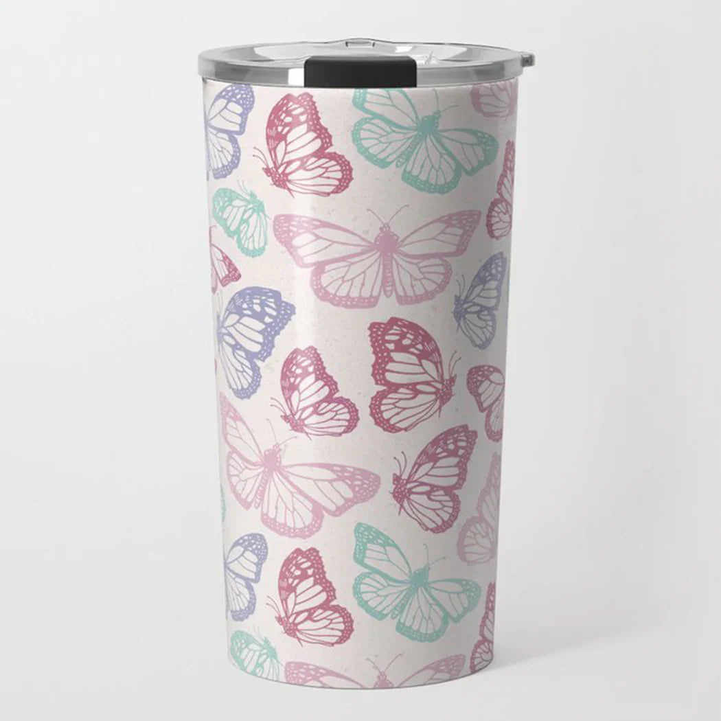 Stainless steel tumbler with pastel butterfly pattern in pink, purple, and teal on white background