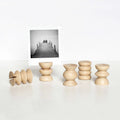 Minimalist wooden photo holders display a black-and-white photo, Qu!rk Boutique gift decor