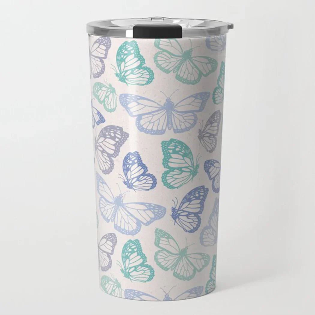 stainless steel tumbler with blue and green butterfly pattern on white background and clear lid